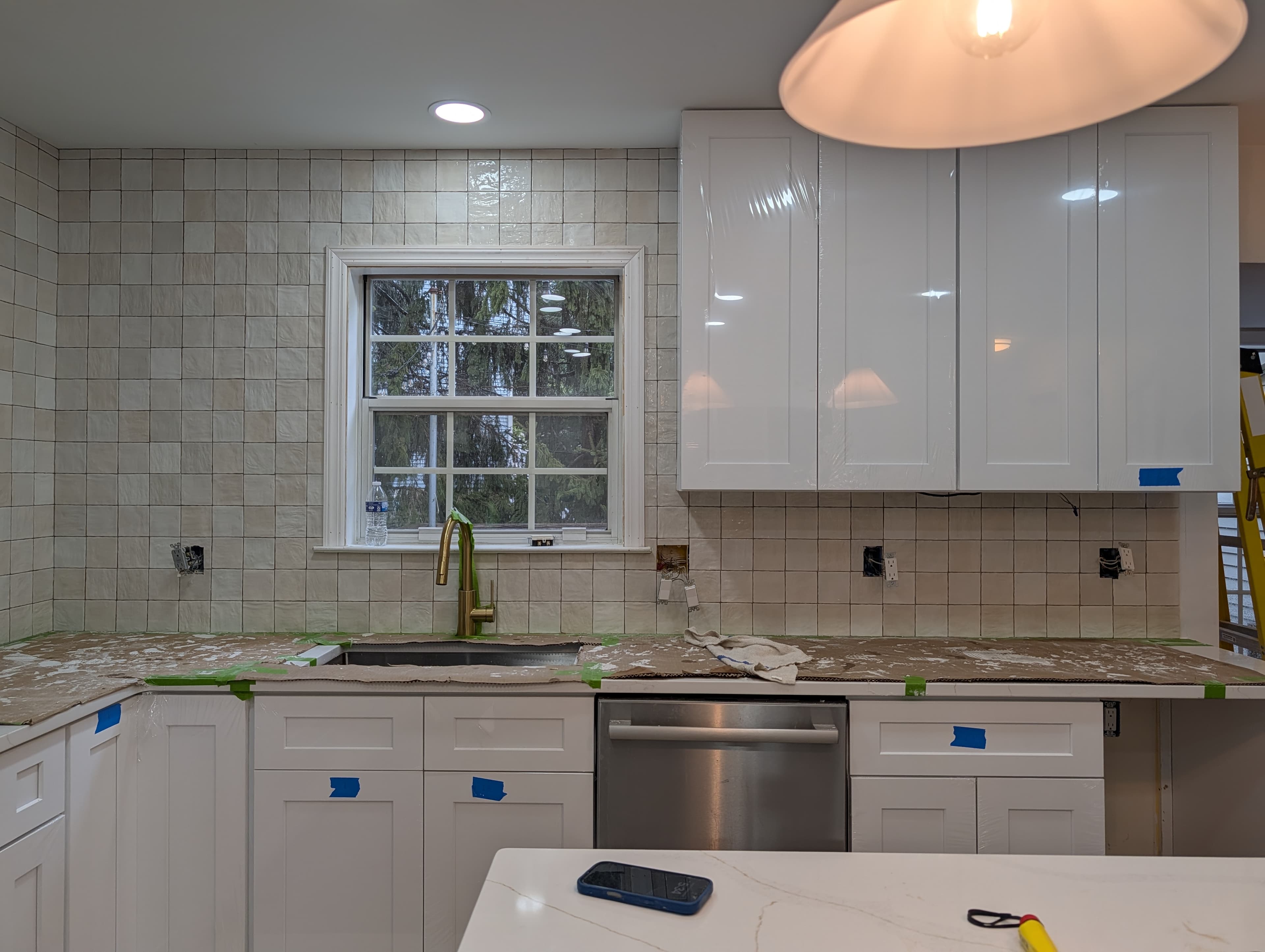 New Herndon kitchen in progress, gas cooktop installed with tile backsplash behind it